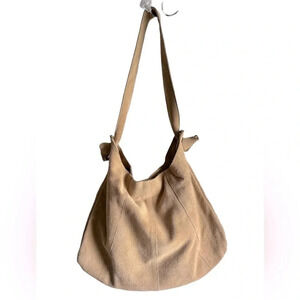 Leather suede Hobo bucket bag with zebra print interior. Khaki, tan color